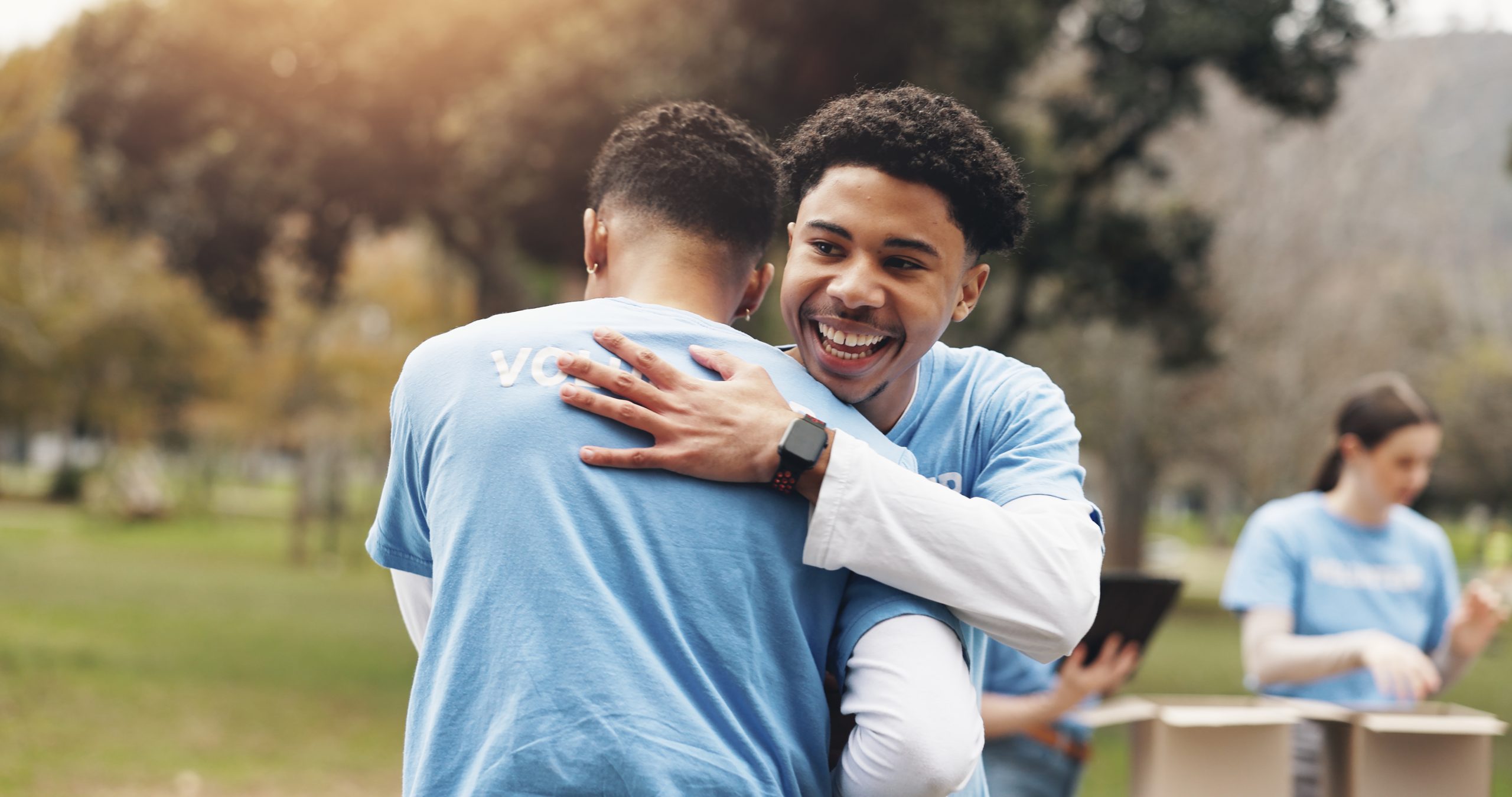 Two community members hugging