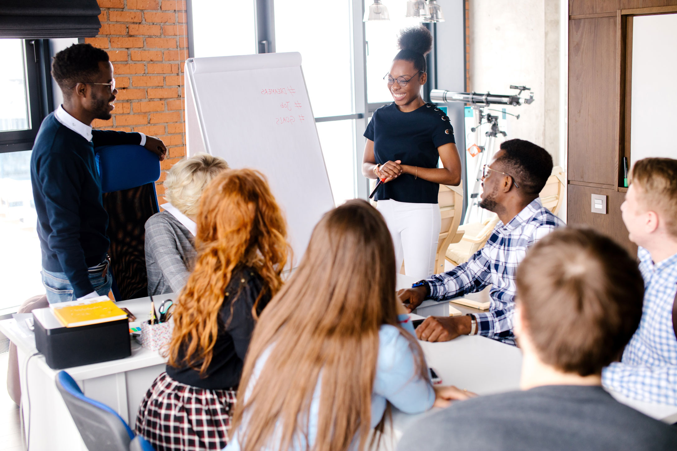 Woman presenting in front of a group